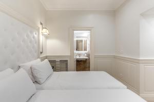 Voodi või voodid majutusasutuse ACA Hotel Viminale toas