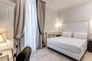 Voodi või voodid majutusasutuse ACA Hotel Viminale toas