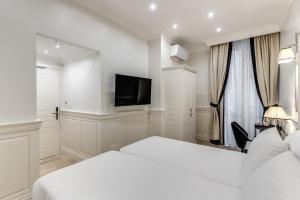 Voodi või voodid majutusasutuse ACA Hotel Viminale toas