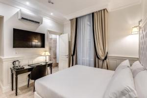 Voodi või voodid majutusasutuse ACA Hotel Viminale toas