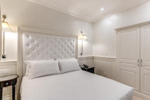 Voodi või voodid majutusasutuse ACA Hotel Viminale toas