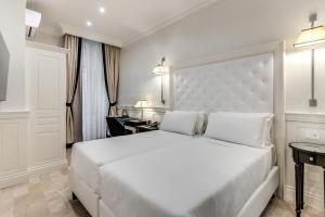 Voodi või voodid majutusasutuse ACA Hotel Viminale toas