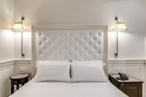 Voodi või voodid majutusasutuse ACA Hotel Viminale toas