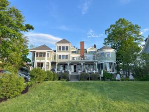 a large house with a lawn in front of it at Saltair Inn Waterfront B&B in Bar Harbor