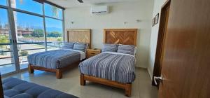 Giường trong phòng chung tại Marina Vallarta Golf and Pool +89 ảnh