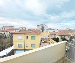 a view from the balcony of a building at Appartamento AL SOLE a Marina di Cecina by Zoom In Earth in Marina di Cecina +14 photos