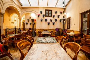 a room with tables and chairs in a building at Anahita Boutique Hotel in Málaga