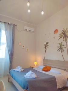 Postel nebo postele na pokoji v ubytování F.A.M. ROOMS + 37 fotografií