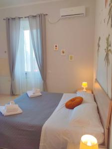 Postel nebo postele na pokoji v ubytování F.A.M. ROOMS