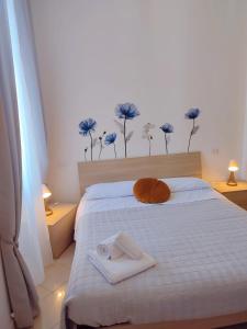 Postel nebo postele na pokoji v ubytování F.A.M. ROOMS