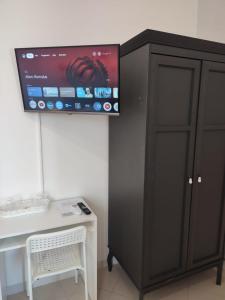 TV a/nebo společenská místnost v ubytování F.A.M. ROOMS