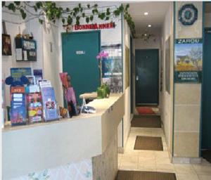 a lobby of a store with a counter and a unintention at Hôtel Aladin in Paris