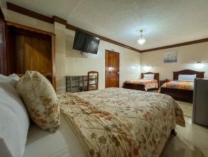 Postel nebo postele na pokoji v ubytování Hotel Bucaneiro + 37 fotografií