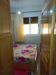 En eller flere senge i et værelse på Appartement Hamza