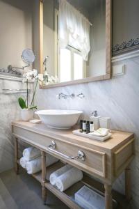 a bathroom with a sink and a mirror at 1905 Boutique Hotel in Xanthi
