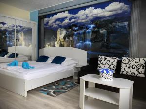 Posteľ alebo postele v izbe v ubytovaní Kék Lagúna Wellness Apartmanok