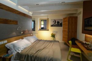 Кровать или кровати в номере Resort Il Gallo Senone