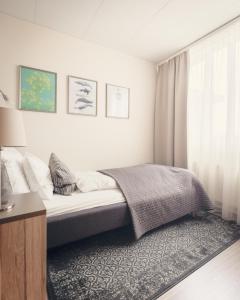 A bed or beds in a room at Hótel Fransiskus Stykkishólmi