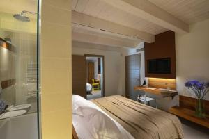 Кровать или кровати в номере Resort Il Gallo Senone
