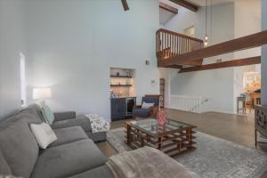 a living room with a couch and a table at Sunshine Lagoon in Sanibel