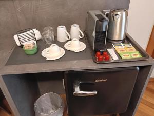 a counter top with a coffee maker and food on it at B&B Lecce Marant in Lecce
