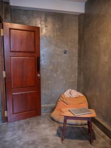 a room with a bed and a table with a laptop on it at Ceylon Stays Hiriketiya in Nilwella +51 photos