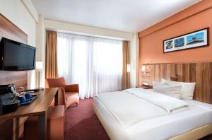 TV a/nebo společenská místnost v ubytování Best Western Hotel Braunschweig Seminarius