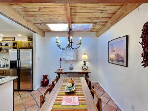 a kitchen and dining room with a table and a chandelier at Artist Road #7 in Santa Fe