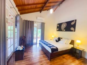 Postel nebo postele na pokoji v ubytování Deer Hill Rest Kandy