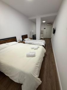 Postel nebo postele na pokoji v ubytování HS Beach