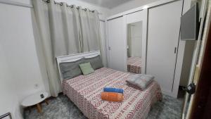 Ένα ή περισσότερα κρεβάτια σε δωμάτιο στο Casa Amarela