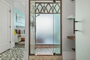 a shower with a glass door in a bathroom at Endless Sunset Retreat in Asheville +41 photos