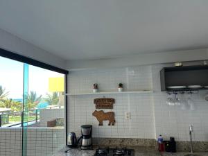 Η κουζίνα ή μικρή κουζίνα στο Tabatinga Flat - Beira Mar