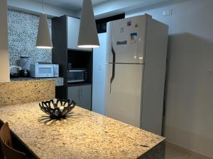 Η κουζίνα ή μικρή κουζίνα στο Tabatinga Flat - Beira Mar