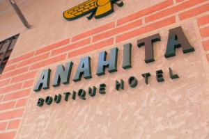 aania sign on the side of a brick building at Anahita Boutique Hotel in Málaga
