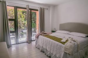 Postel nebo postele na pokoji v ubytování The Madevelyn in Atitlán + 59 fotografií