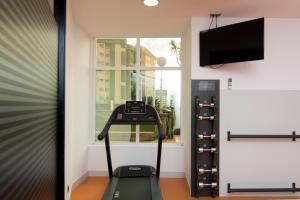 a treadmill in a room with a window at Melia Maria Pita in A Coruña +96 photos