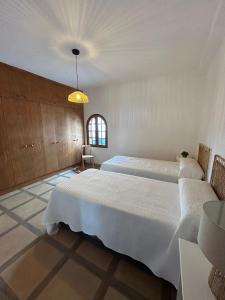 Ένα ή περισσότερα κρεβάτια σε δωμάτιο στο Casa Mari