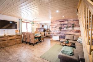 a living room with a couch and a table at Waldstück in Hasselfelde