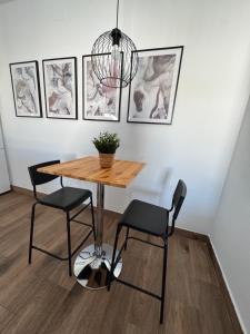 a dining room with a table and two chairs at Villa Armonía in Arcos de la Frontera
