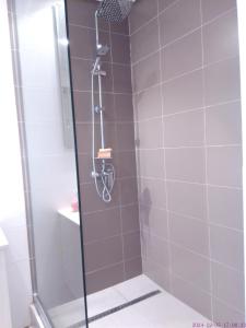 a shower with a glass door in a bathroom at Bip's1 in Dakar +28 photos
