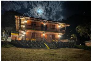 a building with stairs in front of it at night at HOTEL EMBRUJO CAMPESTRE in Jardin