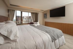 Postel nebo postele na pokoji v ubytování Mahia hotel Reñaca