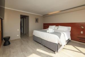 Postel nebo postele na pokoji v ubytování Mahia hotel Reñaca