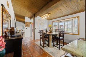 a kitchen and dining room with a table and chairs at Mountain Majesty with AC BBQ Parking in Lemon Grove