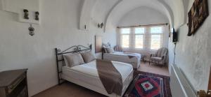 Postel nebo postele na pokoji v ubytování Cappadocia Landscape House
