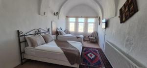 Postel nebo postele na pokoji v ubytování Cappadocia Landscape House