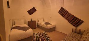 Postel nebo postele na pokoji v ubytování Cappadocia Landscape House