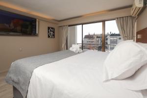 Postel nebo postele na pokoji v ubytování Mahia hotel Reñaca