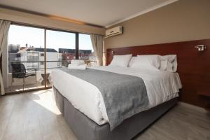 Postel nebo postele na pokoji v ubytování Mahia hotel Reñaca